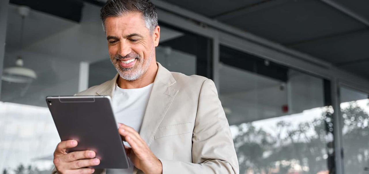 Man holding a tablet.
