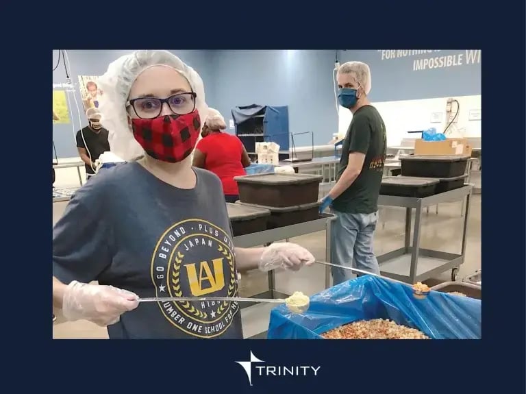 volunteer serving food wearing plaid mask (1)